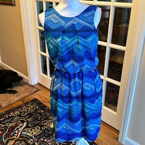 Fully lined dress.  zippered pockets size 6